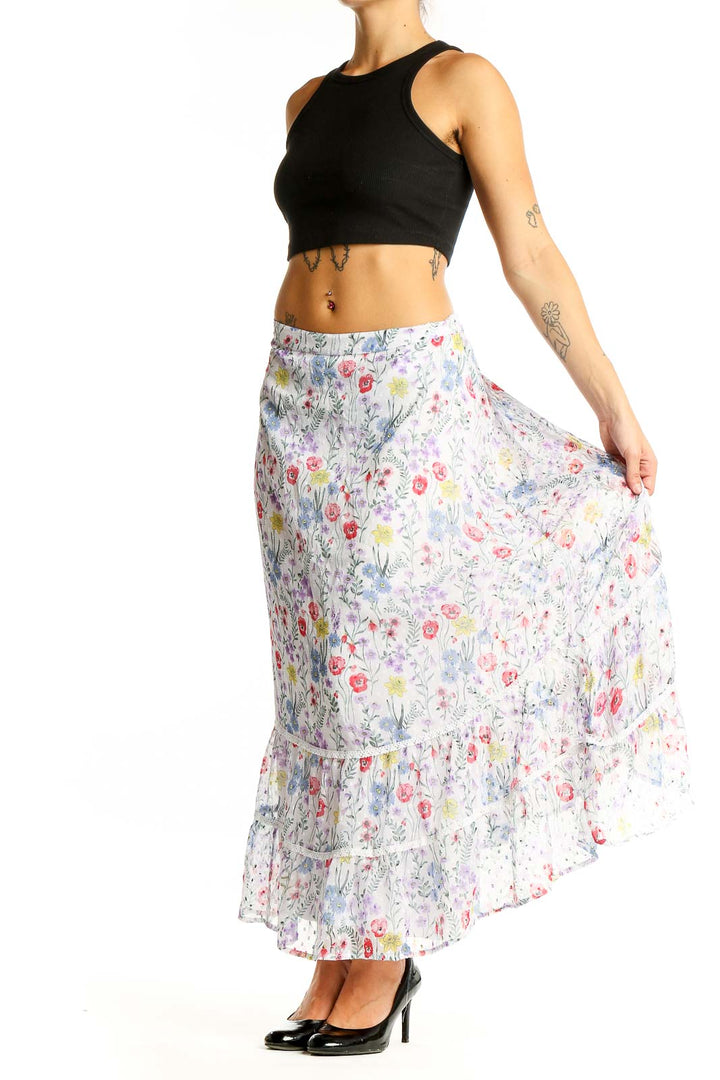 Front view of New Direction white floral tiered maxi skirt with colorful bloom print