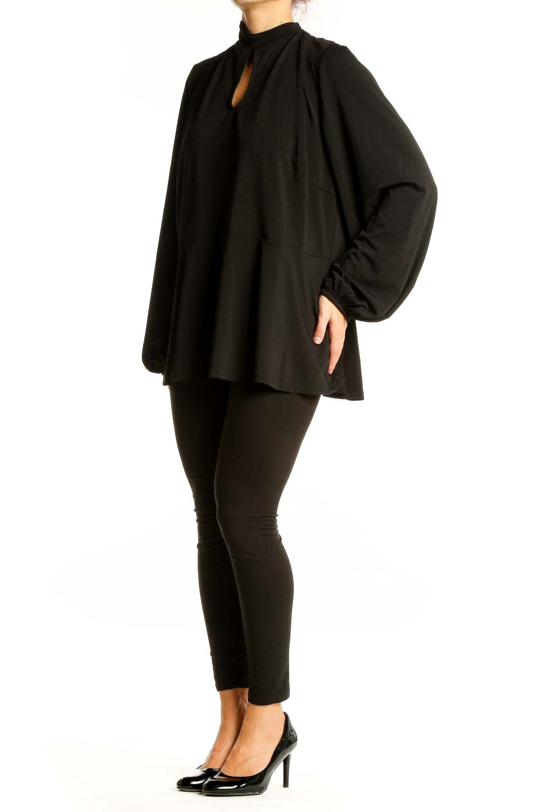 Front view of Eloquii black peplum top with keyhole neckline and long sleeves