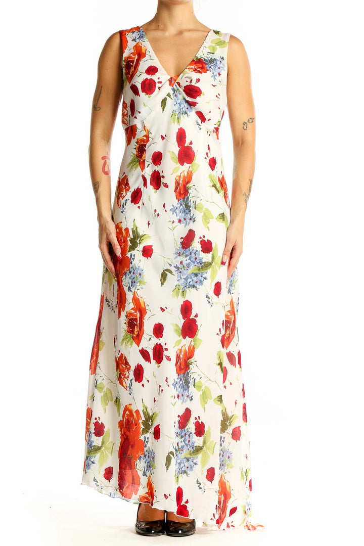 Front view of Tribal white floral maxi dress with red, orange, and blue flowers