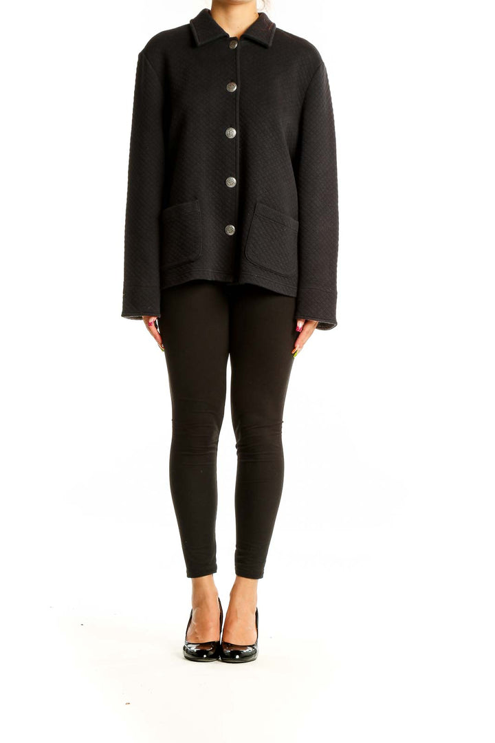 Front view of Koret black quilted button-up jacket with silver buttons