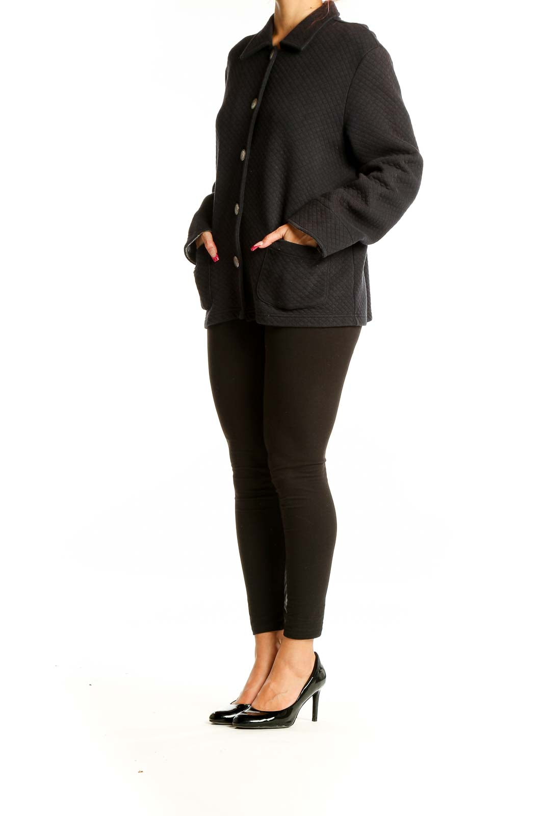 Front view of Koret black quilted button-up jacket with silver buttons