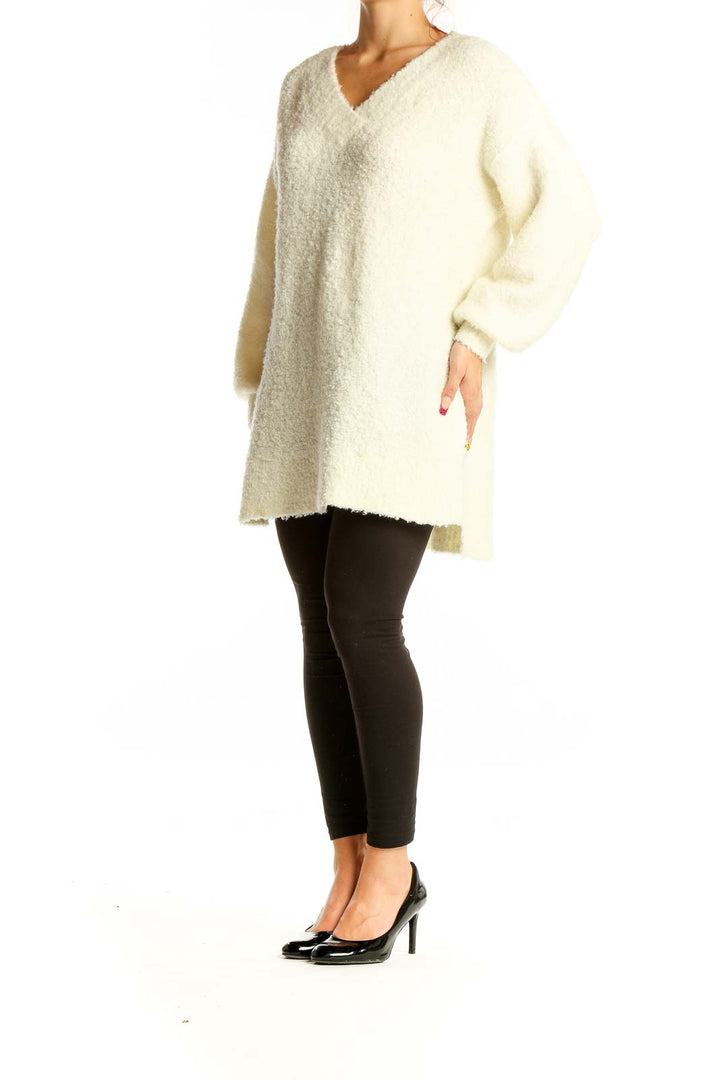 Front view of cream oversized V-neck fuzzy sweater by Pilcro