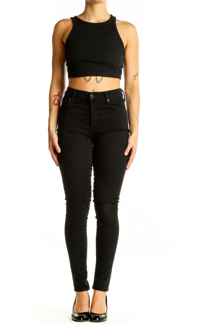 Front view of Citizens of Humanity black high-waisted skinny jeans on model