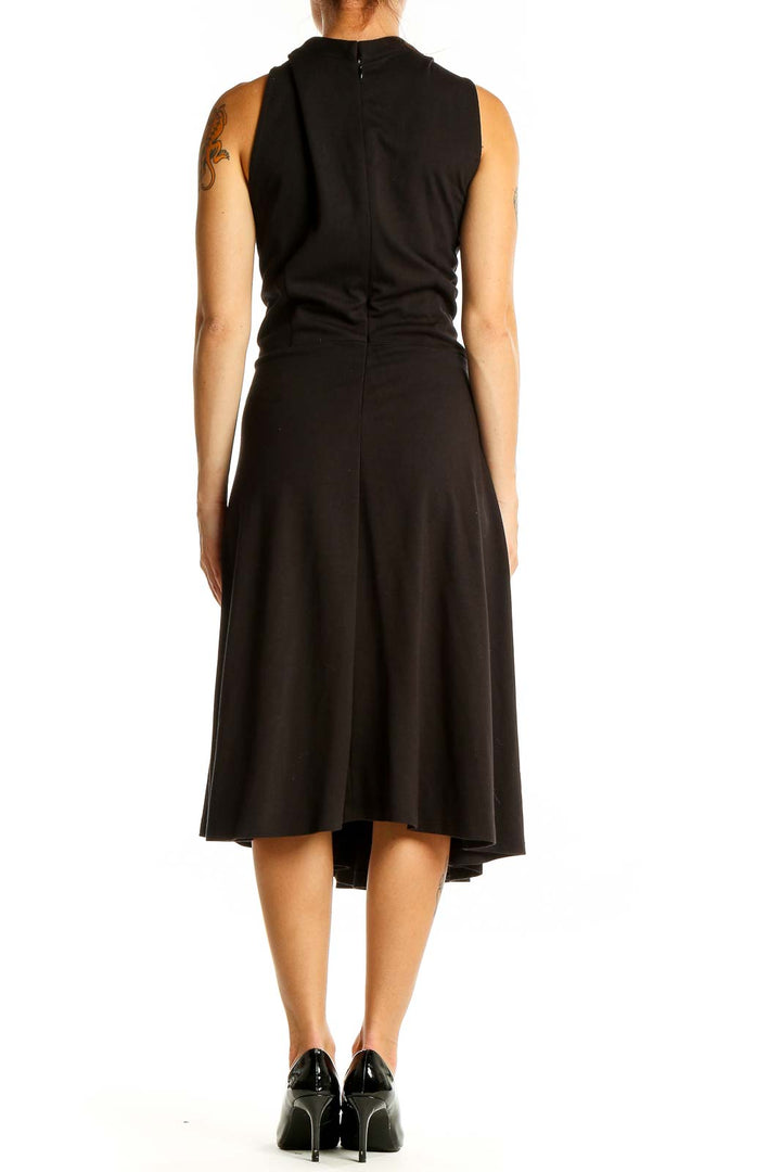 Back view of black Eloquii midi dress showing sleeveless design and A-line skirt