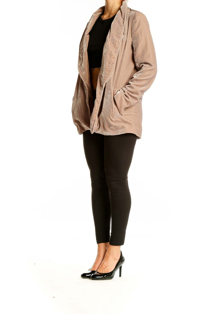 Front view of Free People beige velvet open front jacket on model