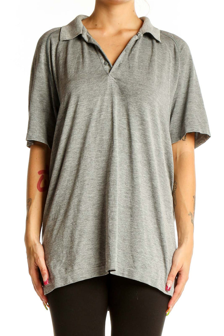 Front view of gray Lululemon oversized polo shirt