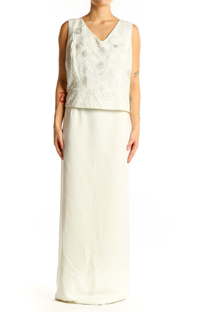 Front view of white R&M Richards maxi dress with embroidered overlay