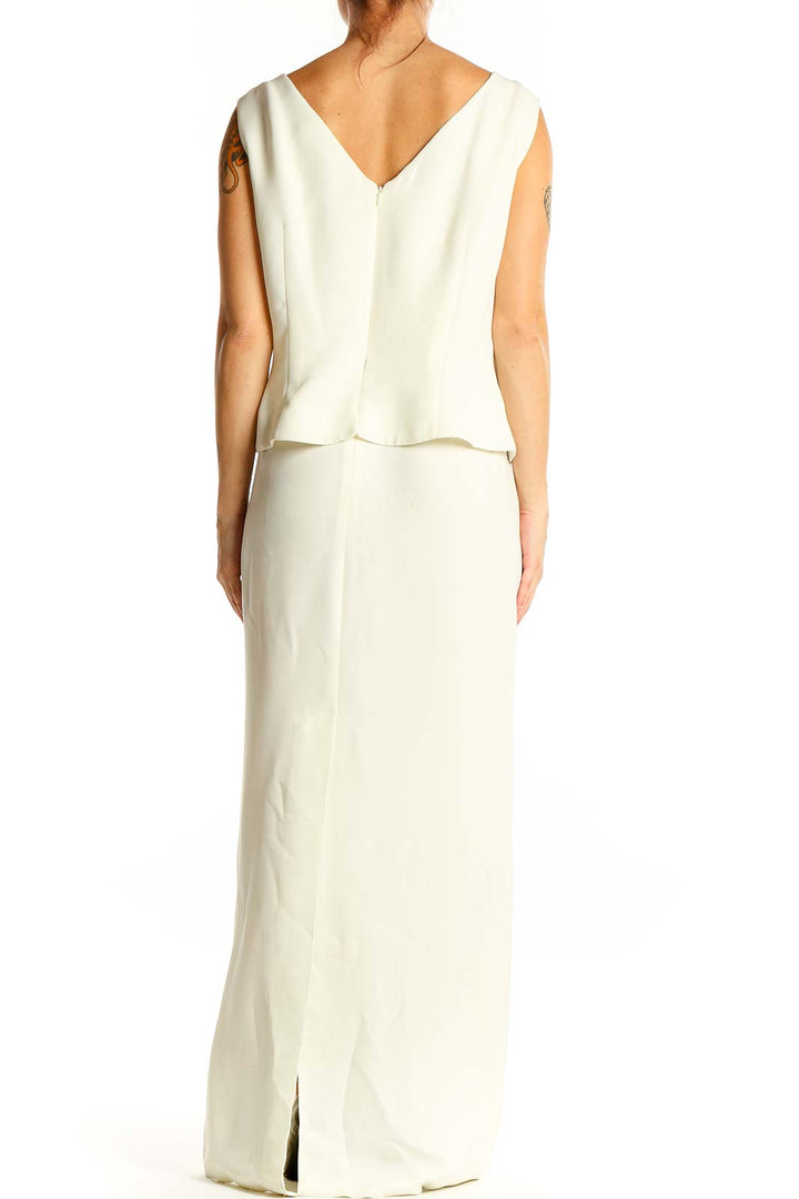 Back view of white R&M Richards maxi dress showing V-neckline and smooth skirt