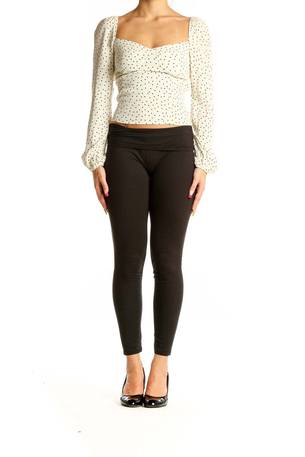 Front view of Reformation cream polka dot crop top with puff sleeves