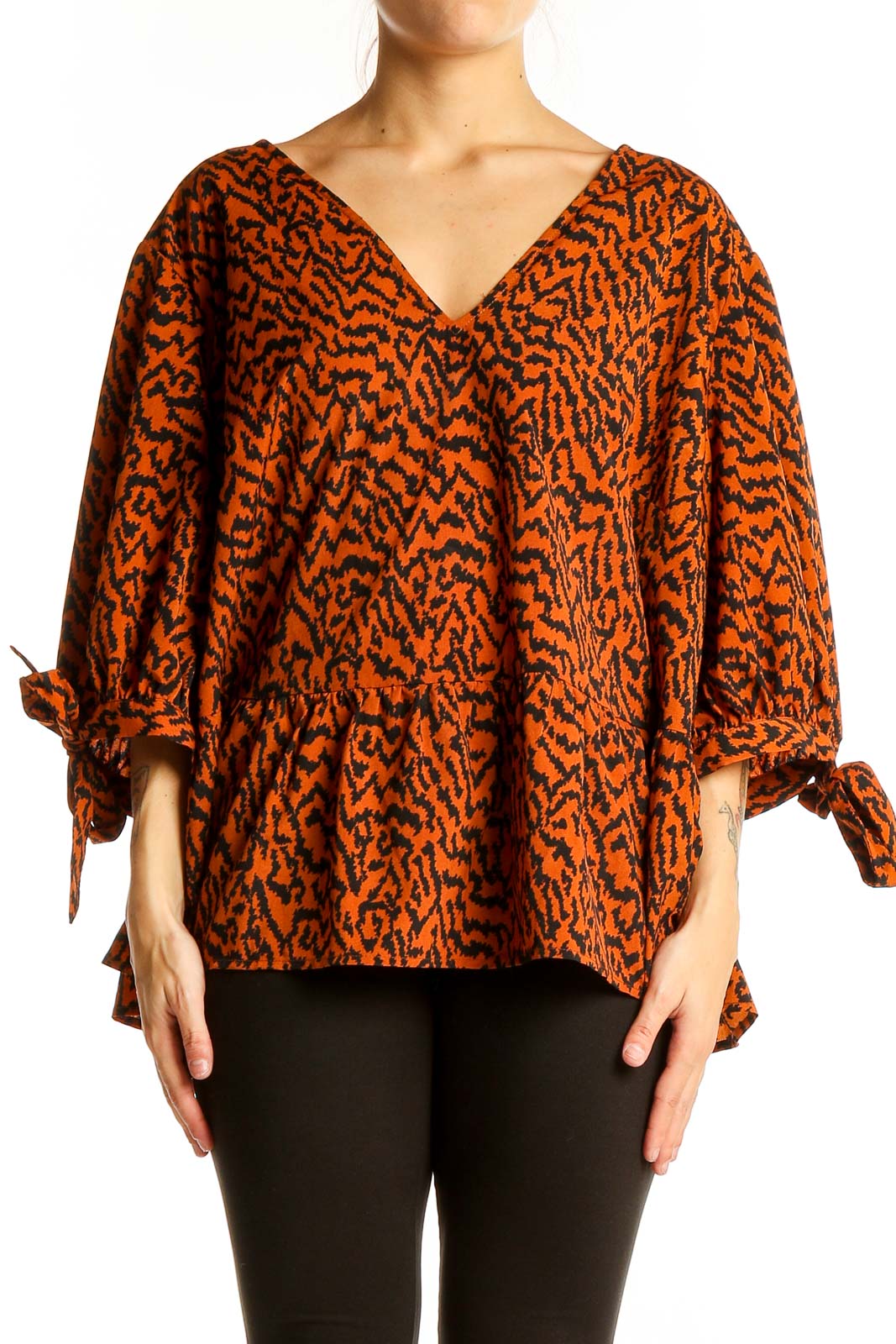 Front view of Eloquii orange abstract print V-neck blouse with tie sleeves