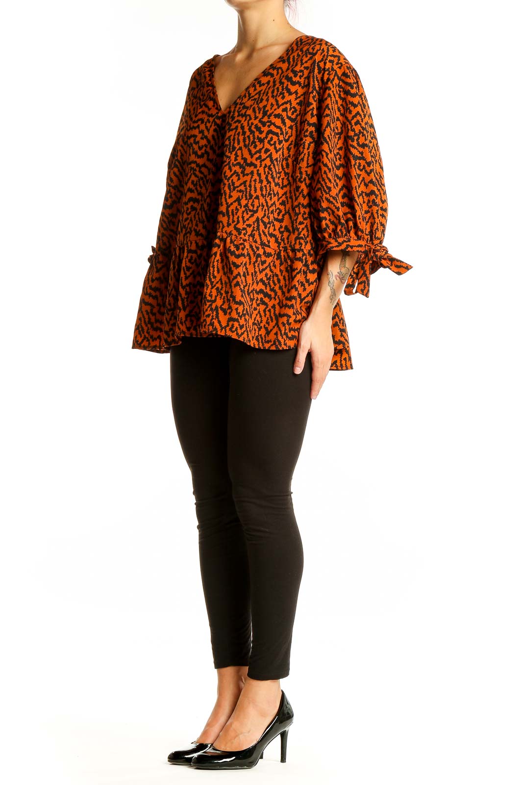 Front view of Eloquii orange abstract print V-neck blouse with tie sleeves