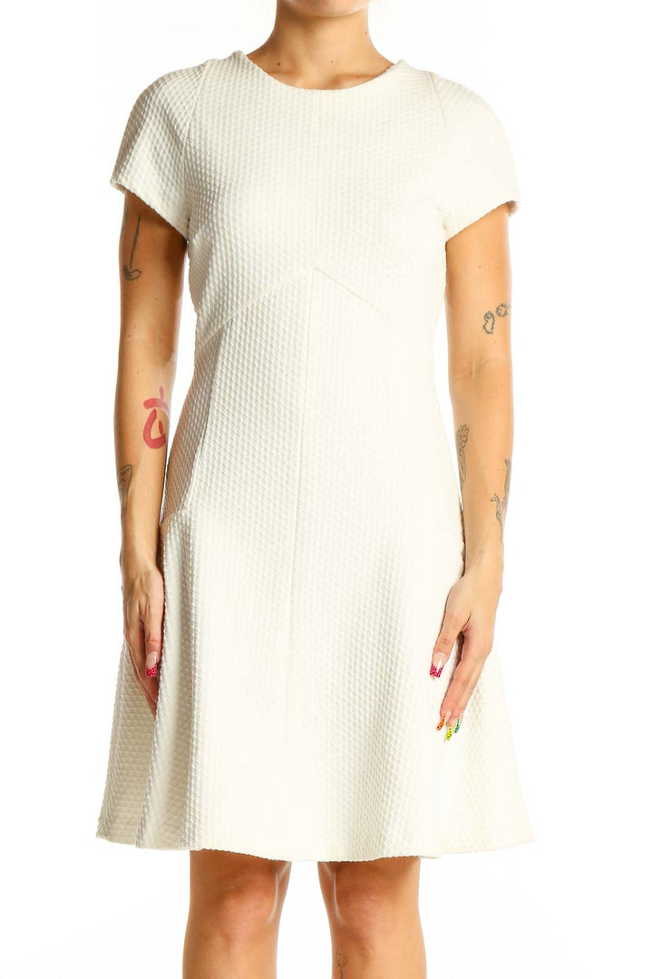 Front view of white textured fit-and-flare dress from Banana Republic