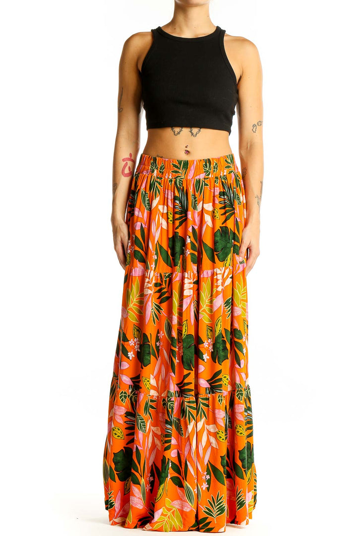 Front view of Eloquii orange tropical print maxi skirt with black crop top