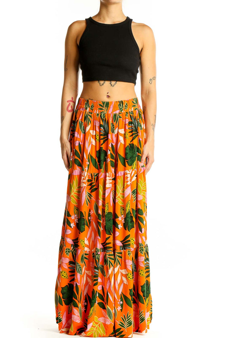 Front view of Eloquii orange tropical print maxi skirt with black crop top