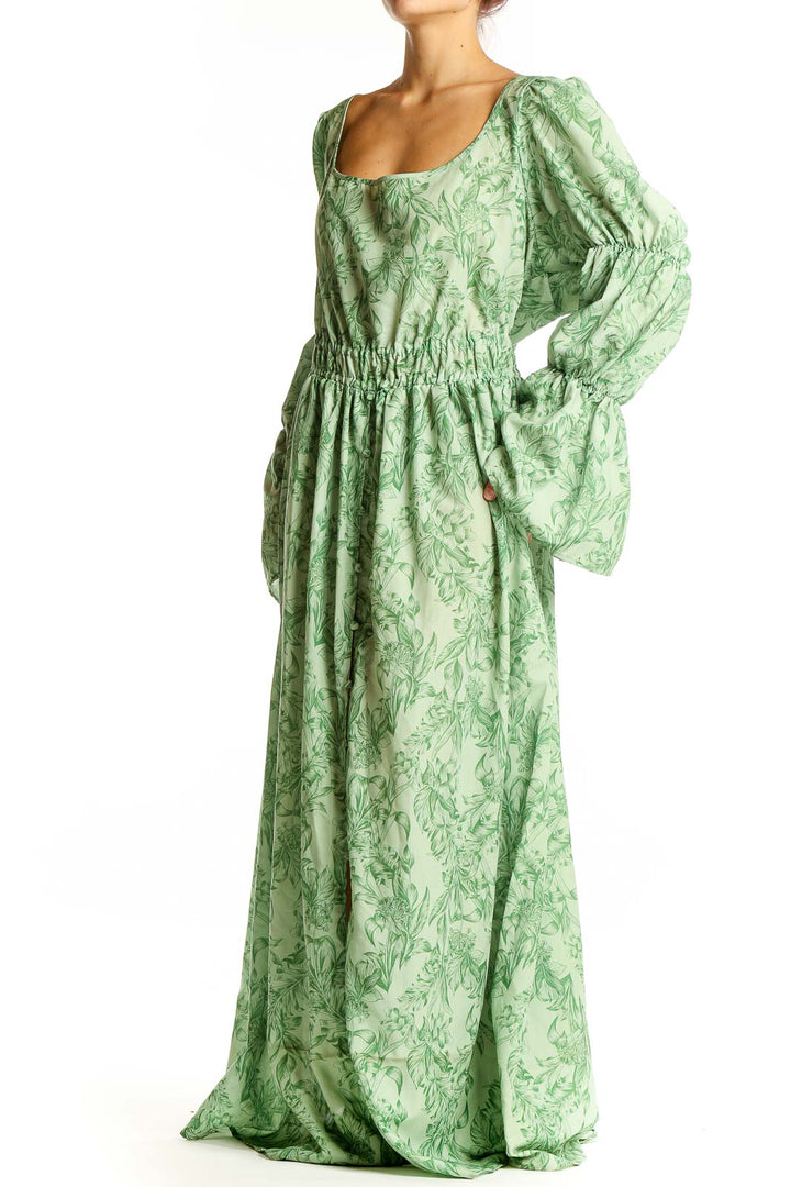 Front view of Eloquii green floral maxi dress with puff sleeves and scoop neckline