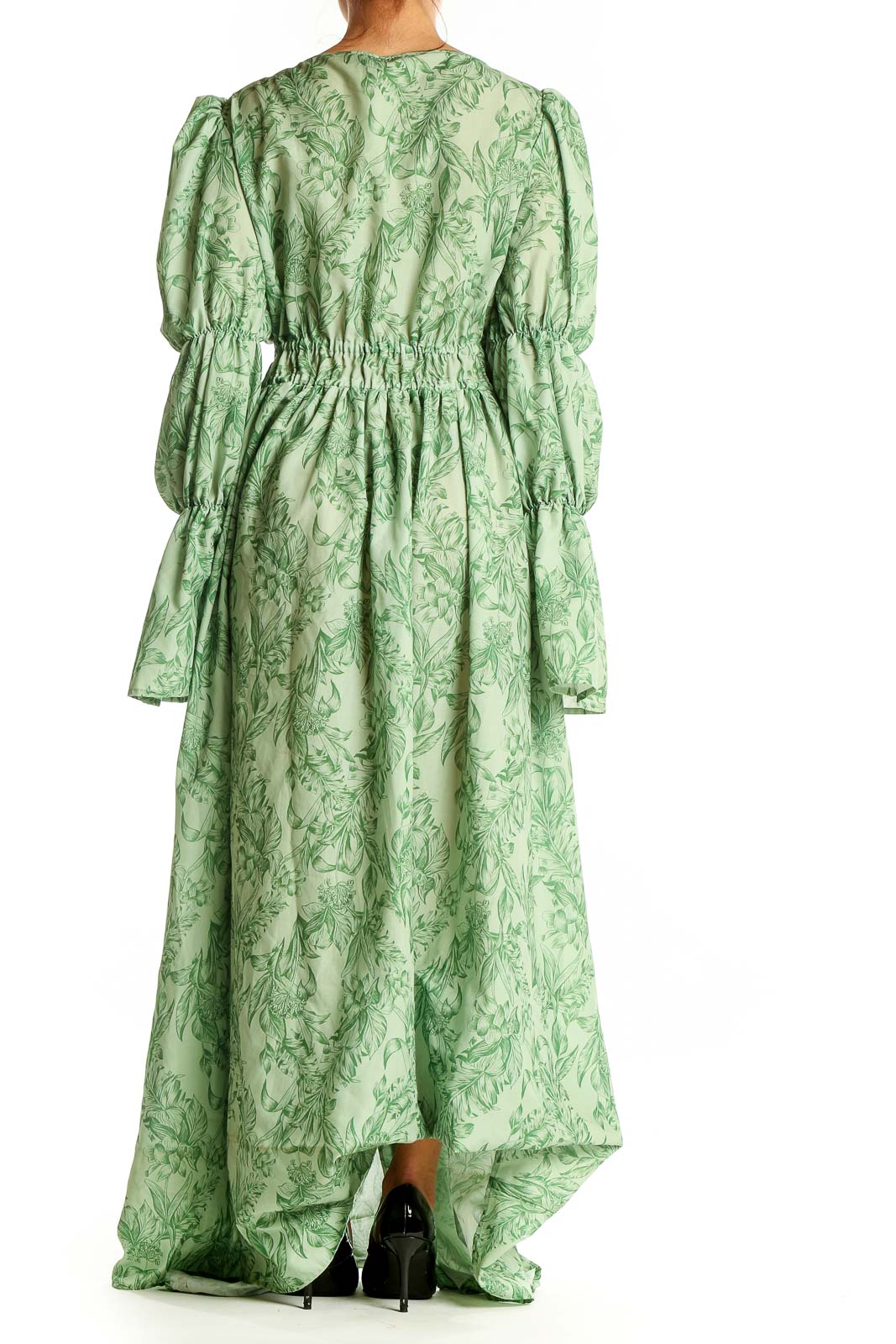 Back view of Eloquii green floral maxi dress showing full-length skirt and puff sleeves