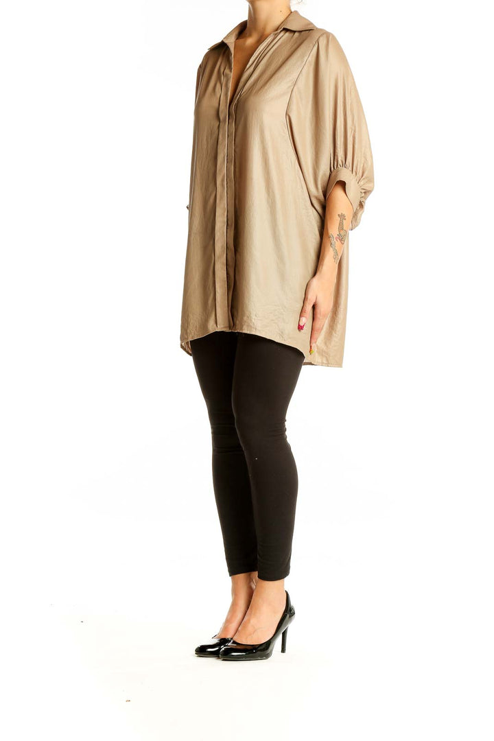 Front view of BCBG MaxAzria beige oversized button-down blouse with dolman sleeves