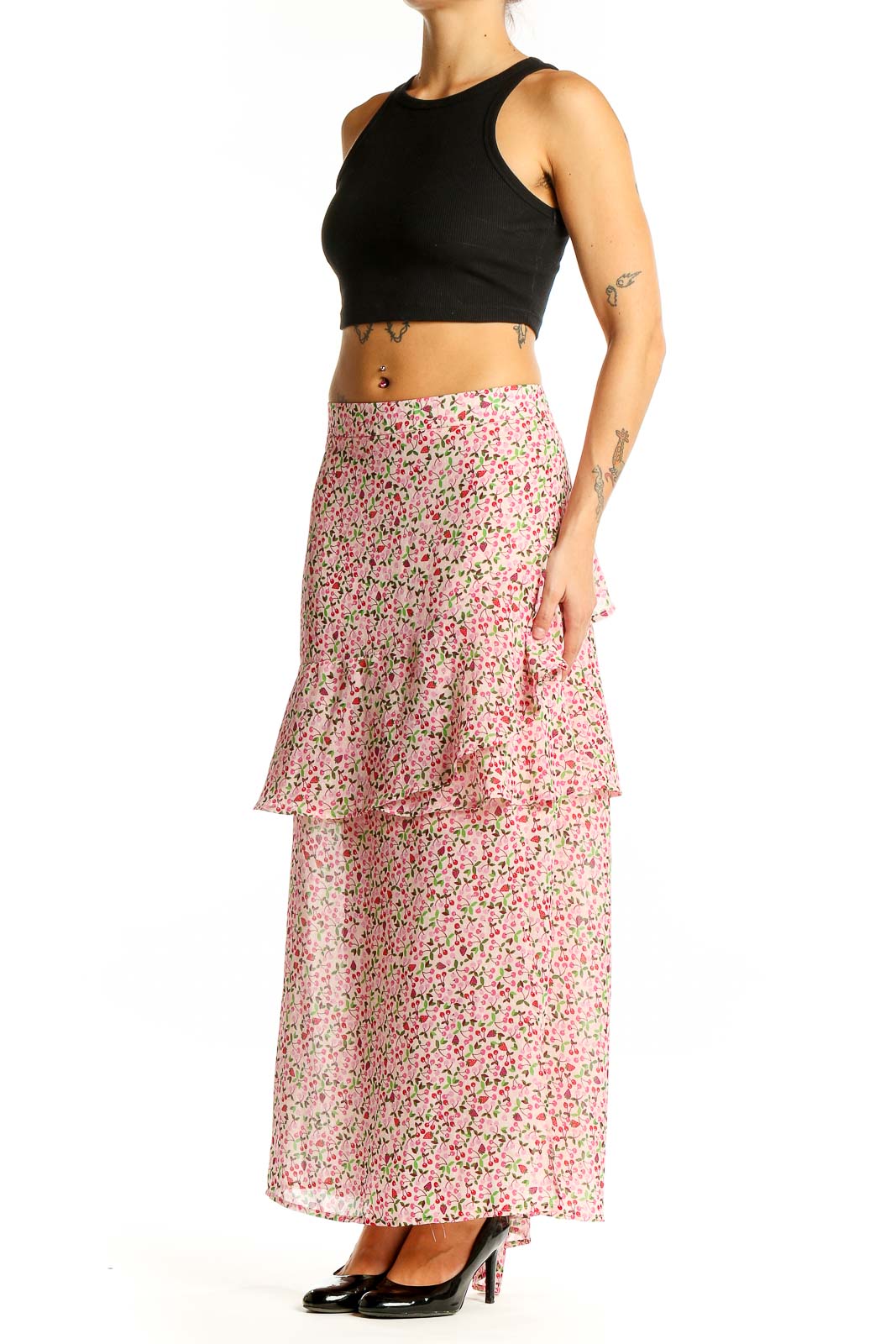 Front view of Eloquii pink floral tiered maxi skirt with black crop top