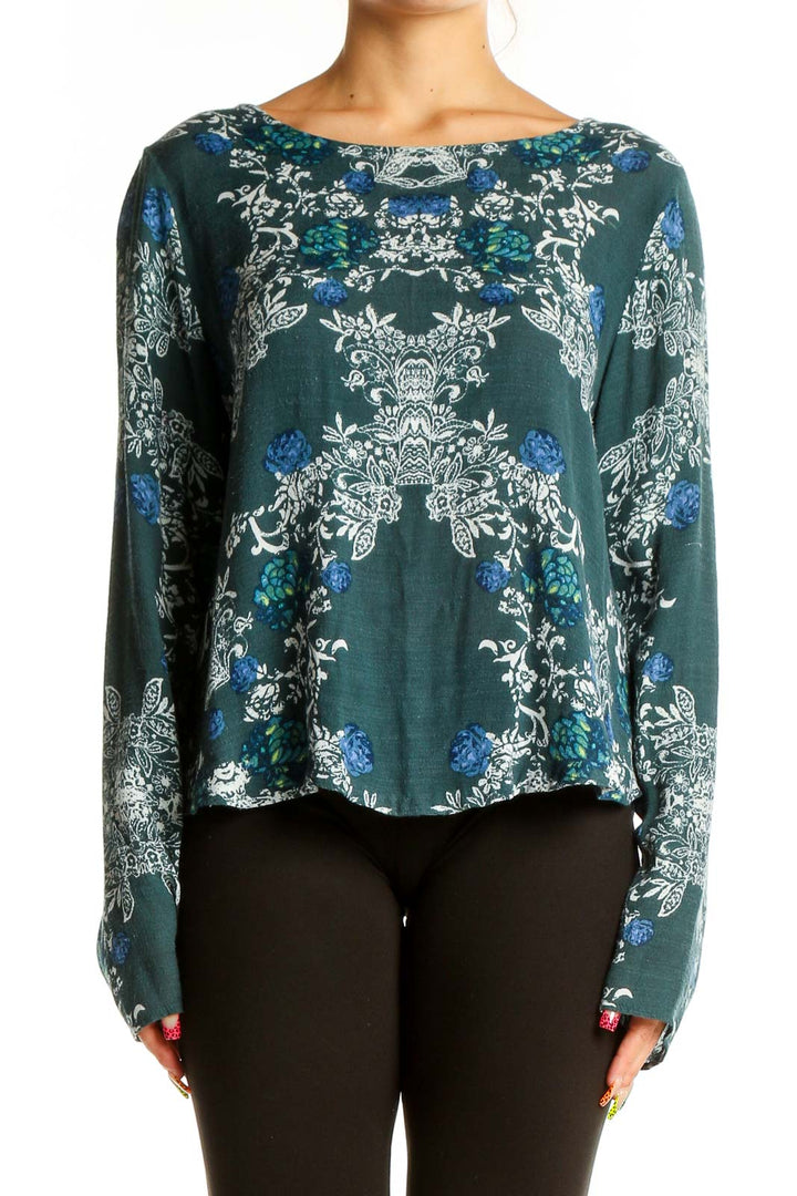 Front view of green floral long sleeve crop top by Free People