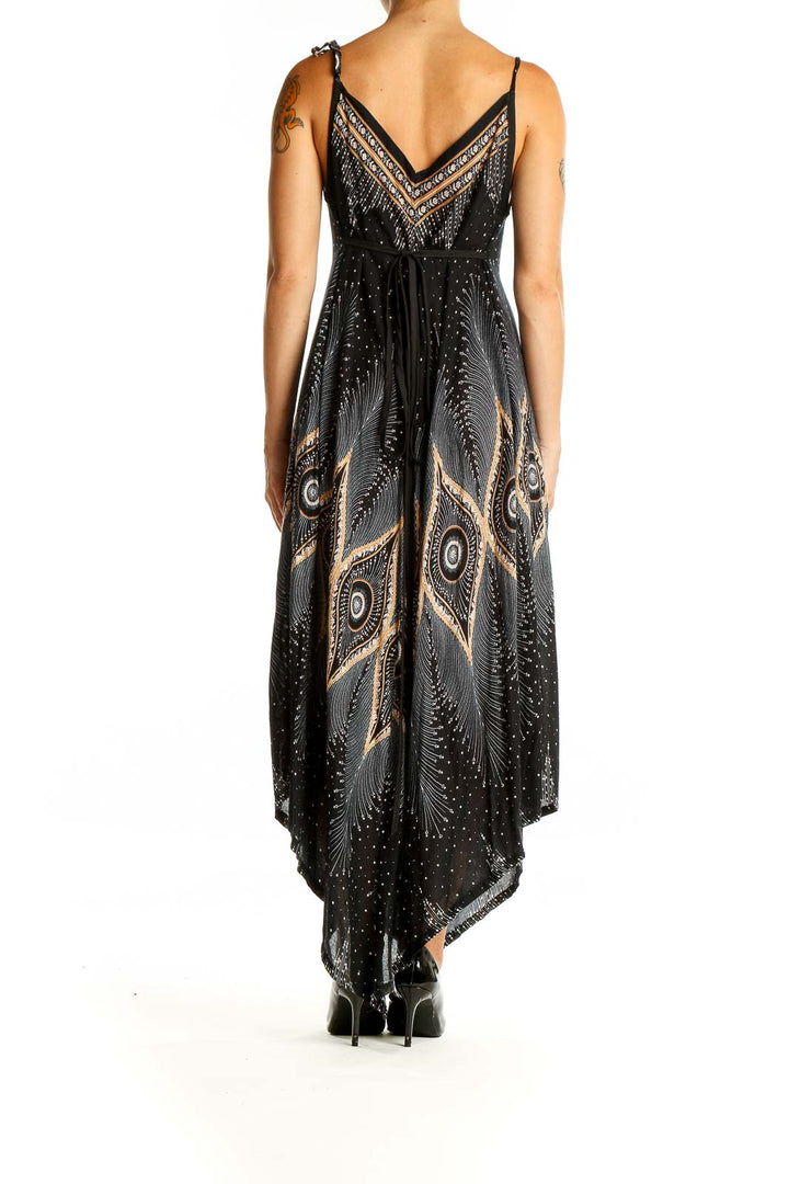 Back view of SilkRoll black maxi dress showing asymmetrical hem and tie back