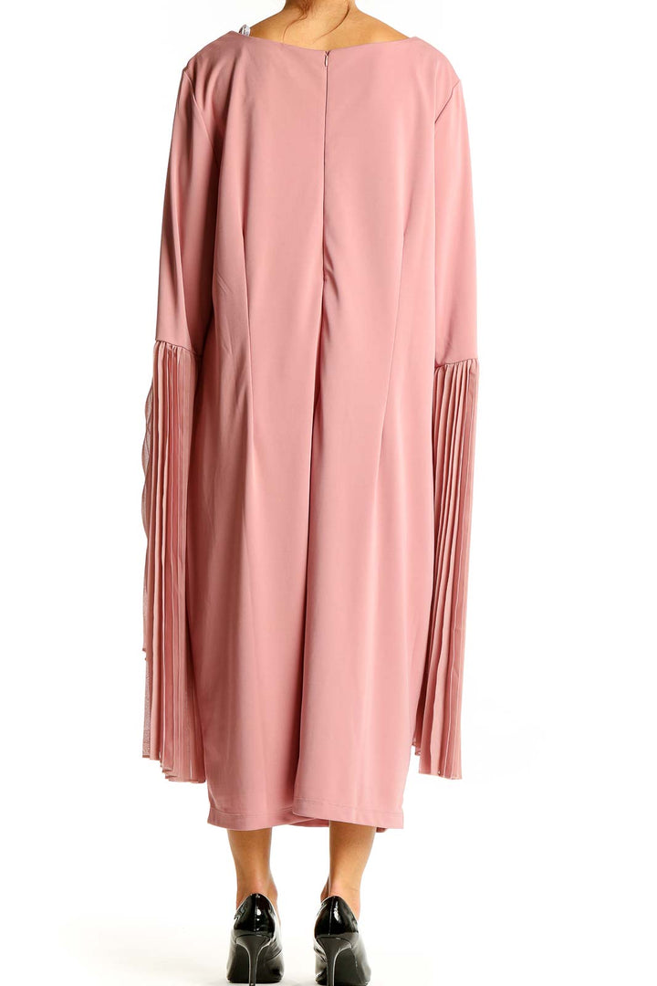 Back view of pink Eloquii midi dress showing pleated bell sleeves and zipper closure