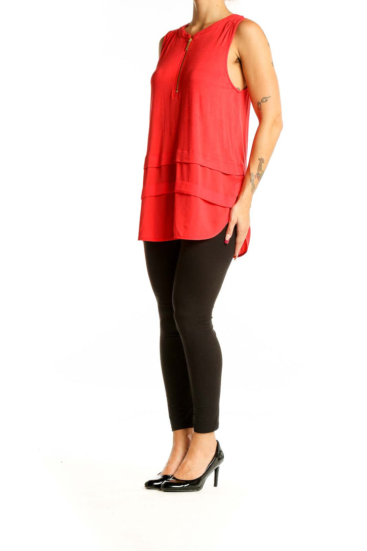 Front view of red sleeveless layered top by MICHAEL Michael Kors with zip-front closure