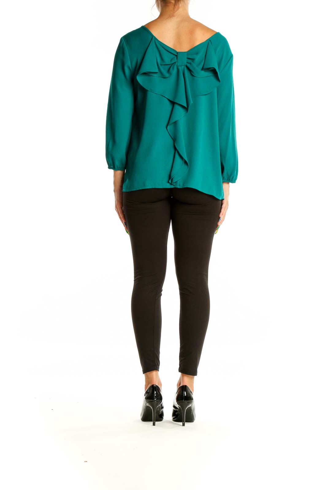 Back view of teal blouse showcasing elegant bow detail