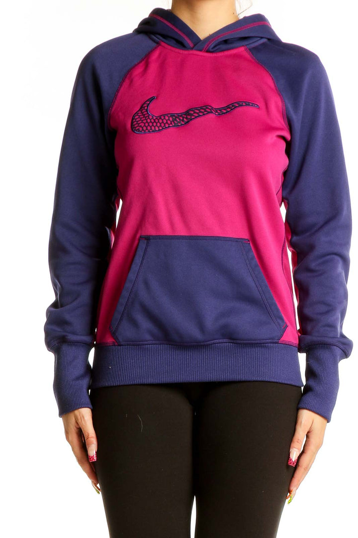 Front view of pink and navy Nike colorblock hooded sweatshirt with large swoosh logo