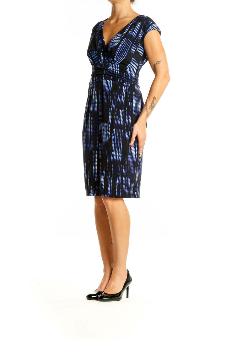 Front view of Calvin Klein blue and black abstract print sheath dress with V-neckline