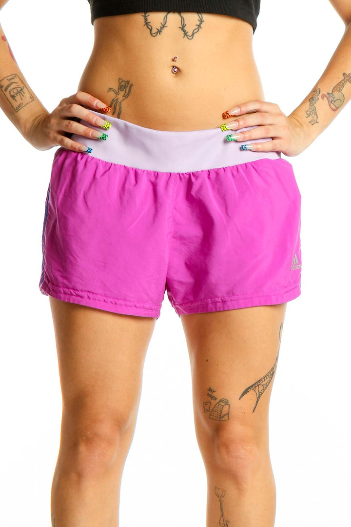 Front view of pink Adidas running shorts with lilac waistband