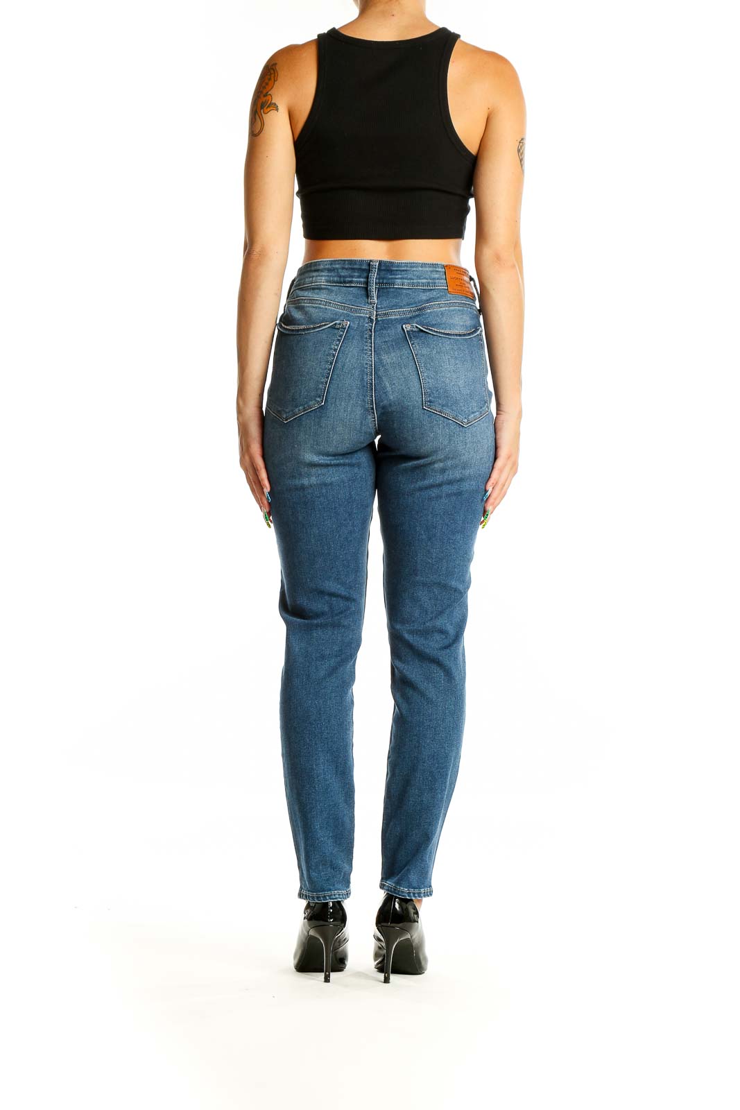 Back view of Lucky Brand blue straight leg jeans on model