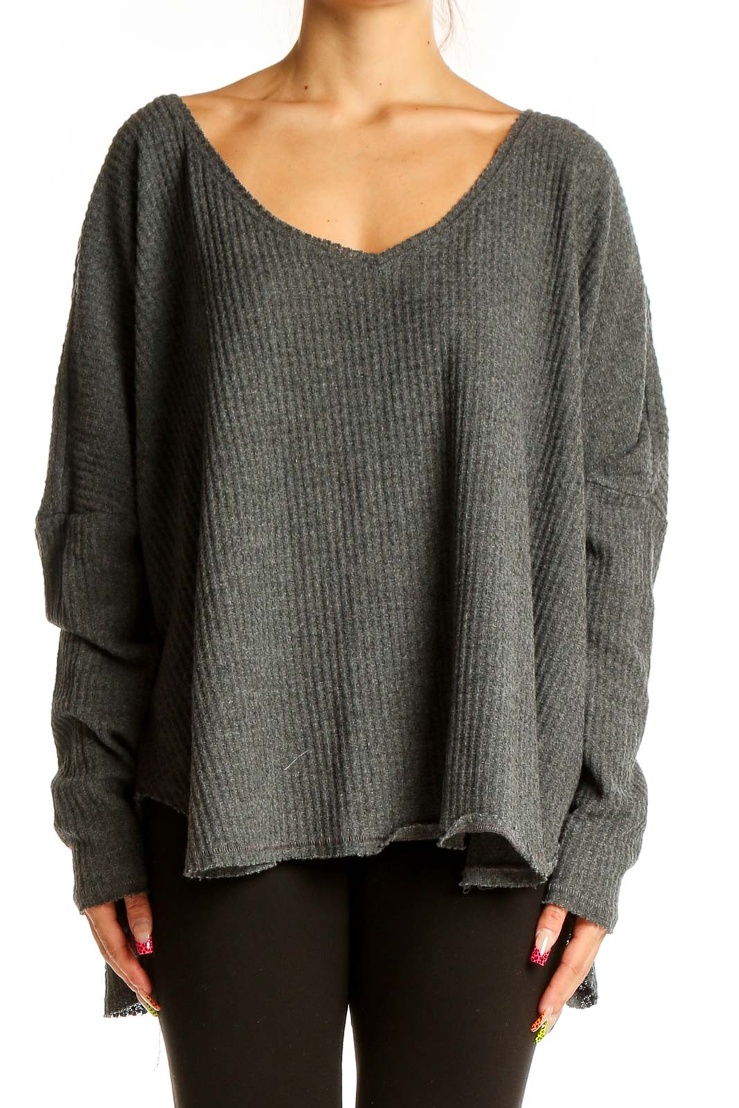 Front view of gray oversized ribbed knit sweater with deep V-neckline