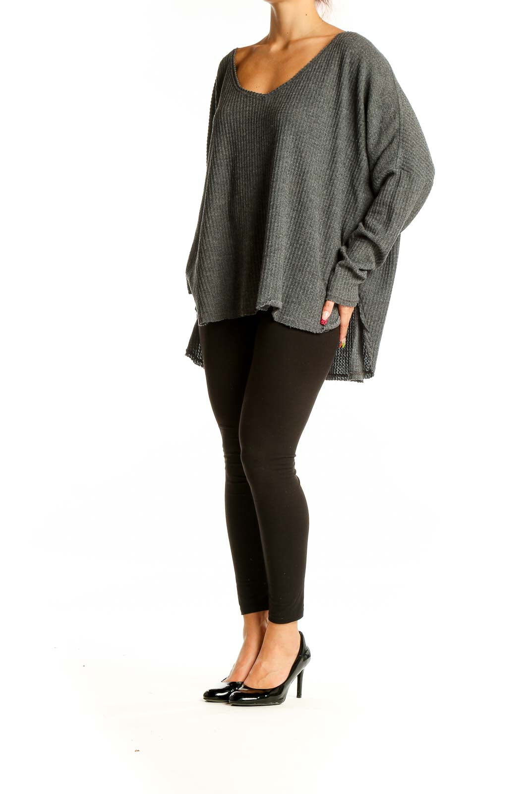 Front view of gray oversized ribbed knit sweater with deep V-neckline