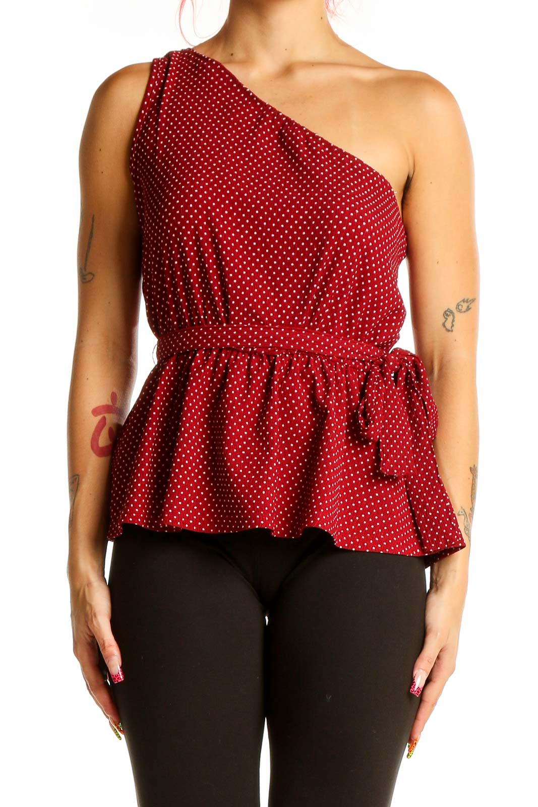 Front view of SilkRoll red polka dot one-shoulder peplum top