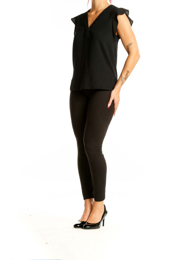 Front view of Zara black V-neck blouse with cap sleeves