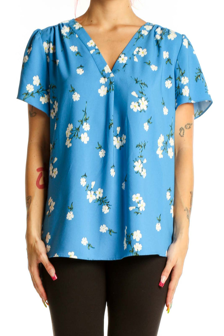 Front view of Hilary Radley blue floral V-neck blouse with short sleeves