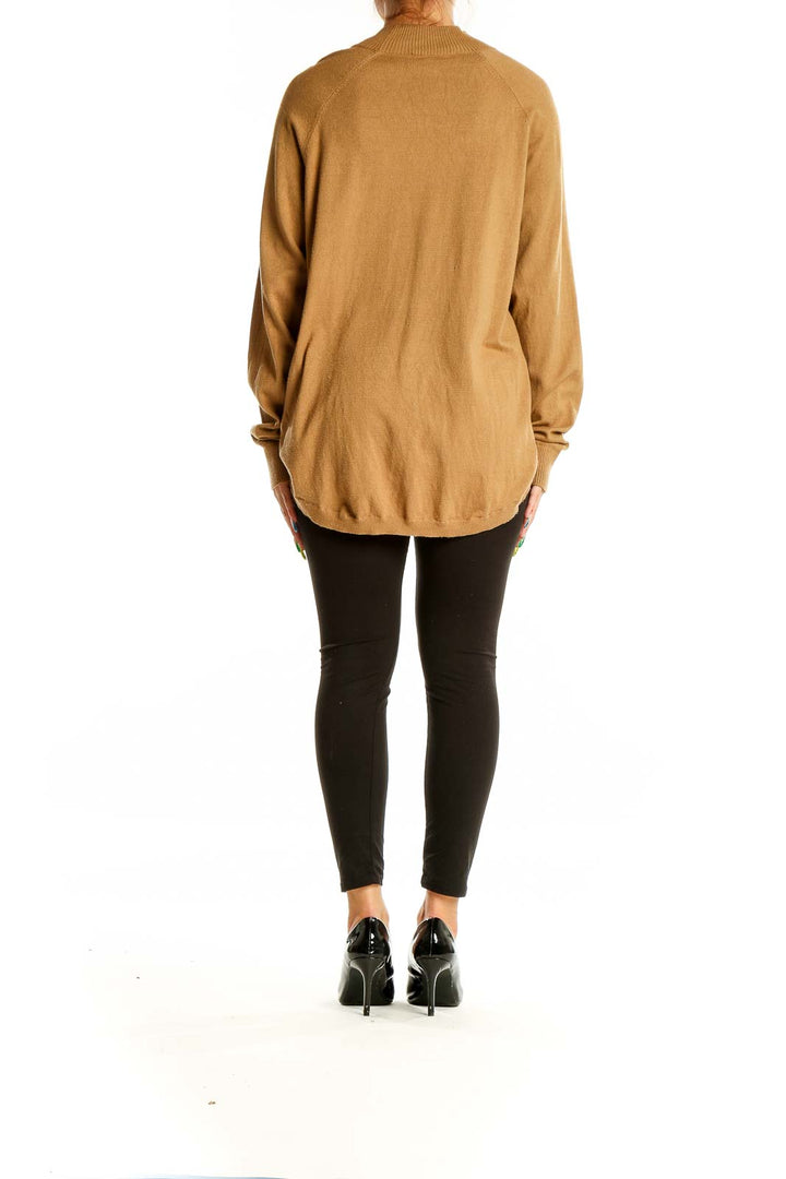 Back view of camel Michael Kors mock neck sweater showing relaxed fit