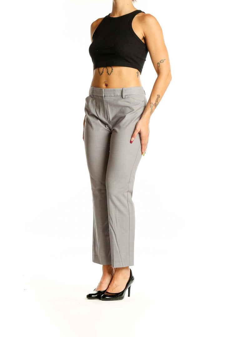 Front view of gray Theory tailored trousers on model