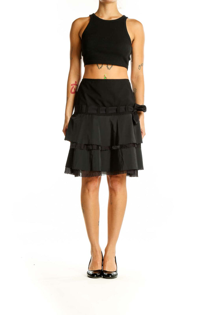 Front view of Elie Tahari black tiered ruffle skirt with bow-detailed waistband