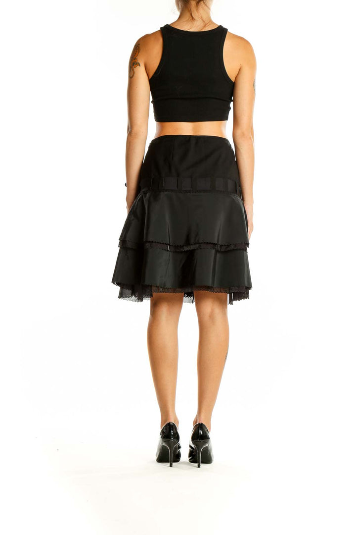 Back view of Elie Tahari black tiered ruffle skirt showing layered design