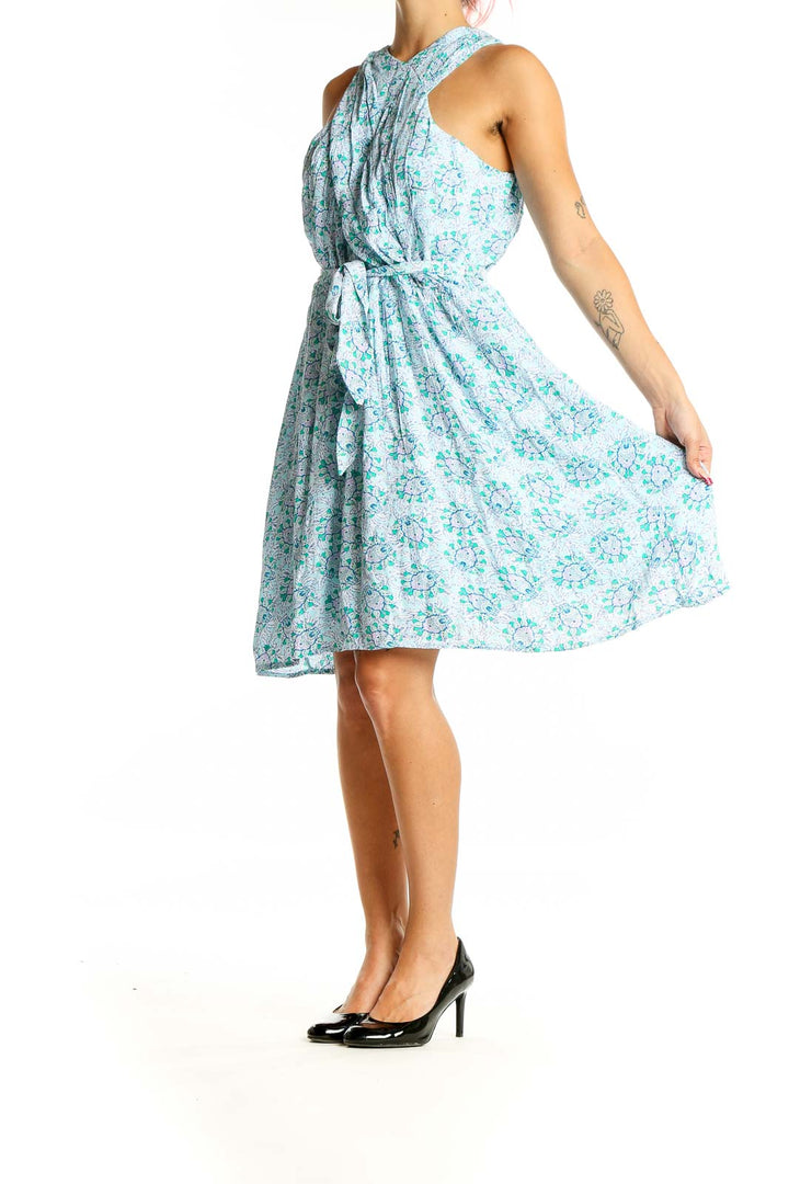 Front view of LOFT blue floral halter dress with gathered waist