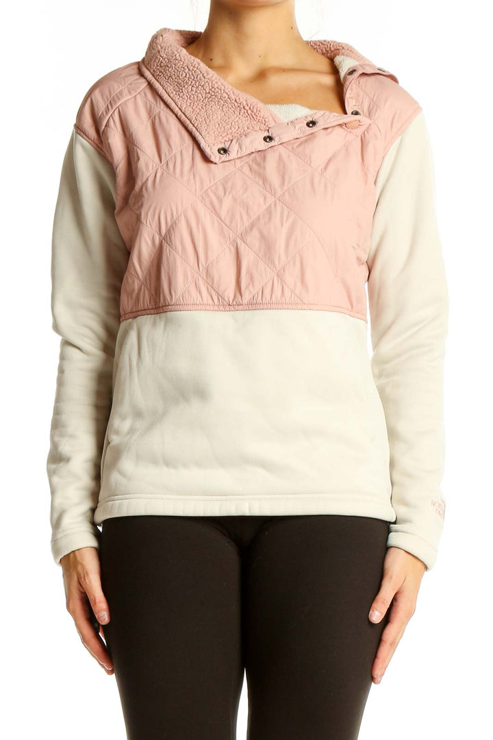 Front view of The North Face pink and white quilted fleece pullover with asymmetrical snap collar