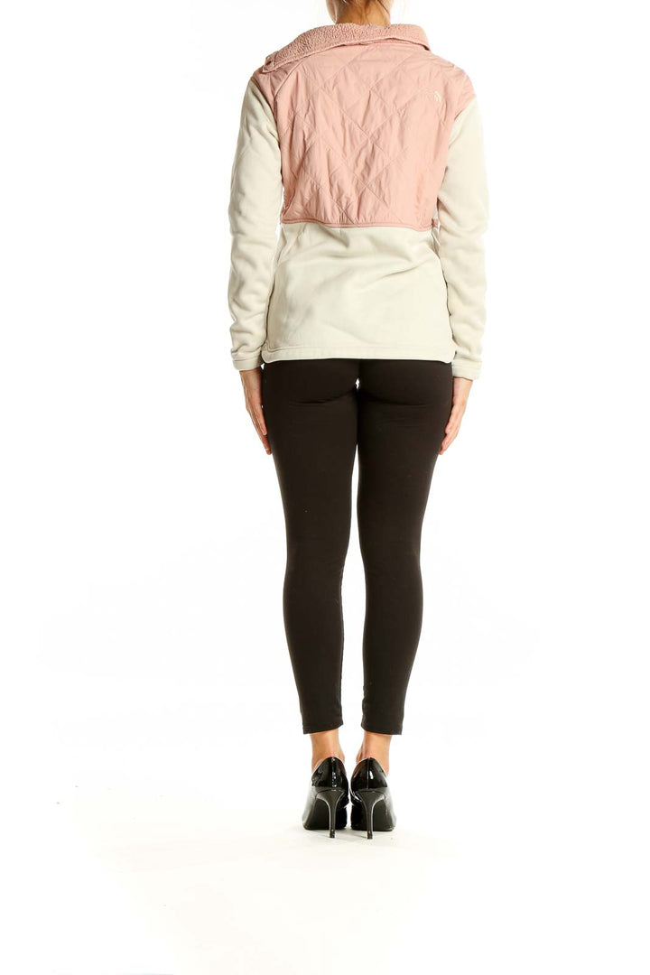 Back view of The North Face pink and white quilted fleece pullover showing two-tone design