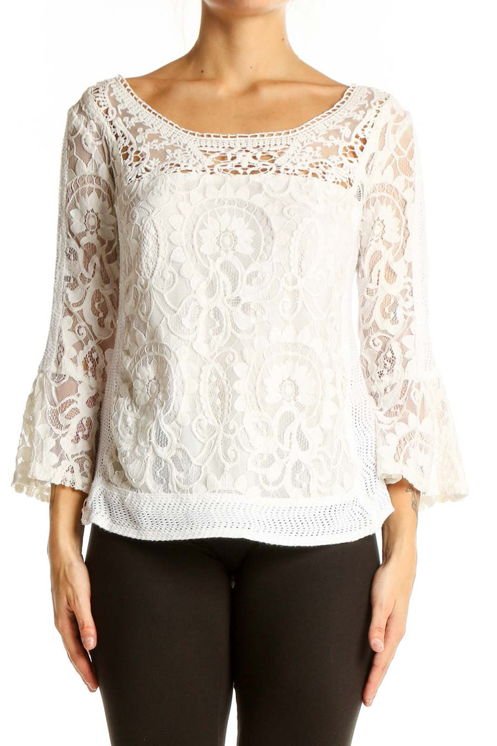 Front view of Nanette Lepore white lace blouse with bell sleeves