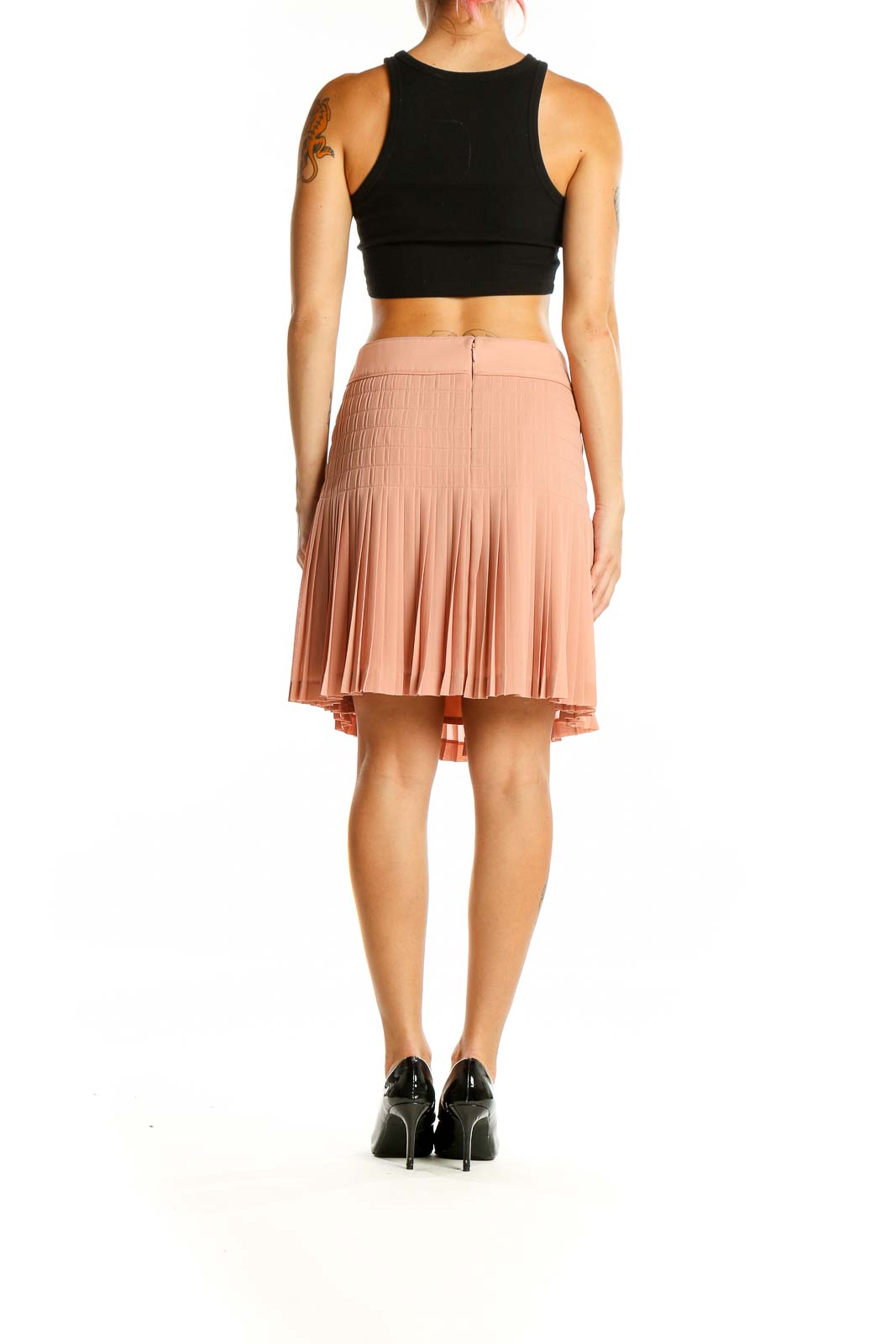 Back view of J.Crew blush pleated polyester mini skirt on model