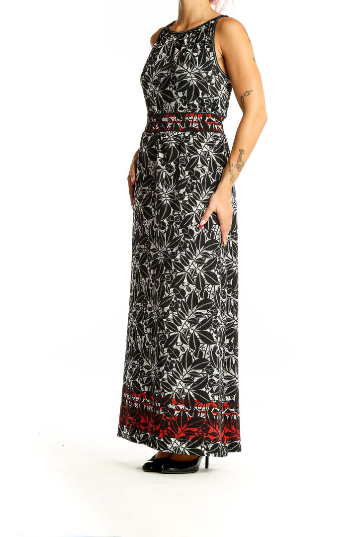 Front view of Max Studio Black Floral Print Maxi Dress with white floral pattern and red border