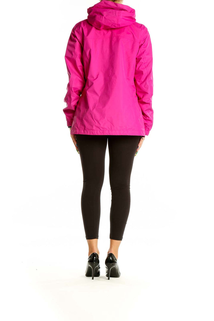 Back view of pink Columbia waterproof jacket on model