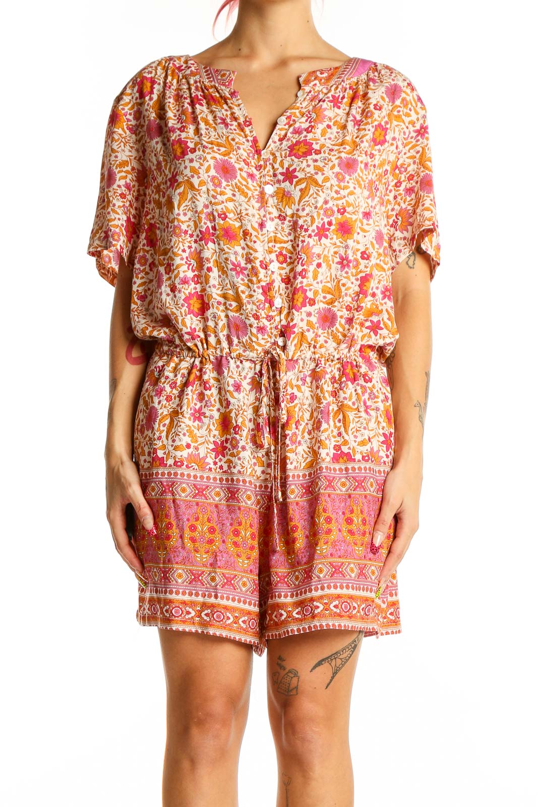 Front view of Lucca pink floral rayon romper with v-neck and short sleeves