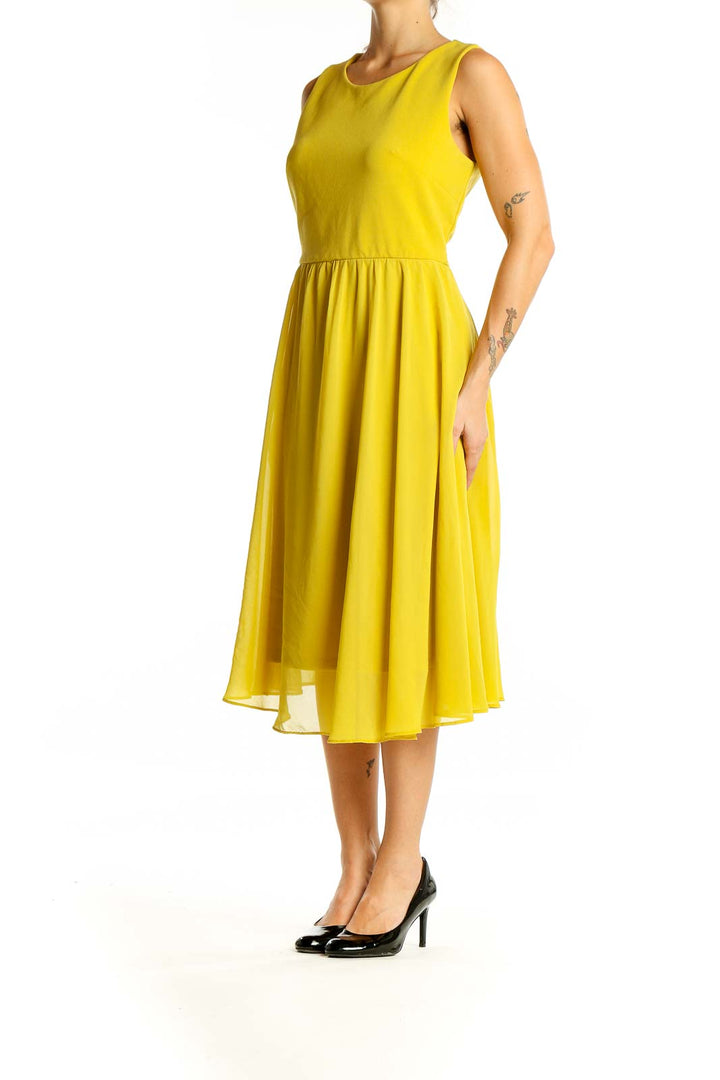 Front view of Shelby & Palmer yellow sleeveless midi dress with A-line silhouette