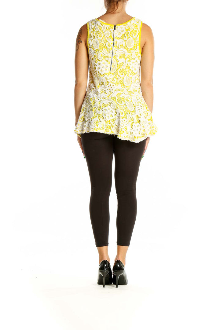 Back view of Meadow Rue Yellow Floral Lace Peplum Tank Top showing exposed zipper